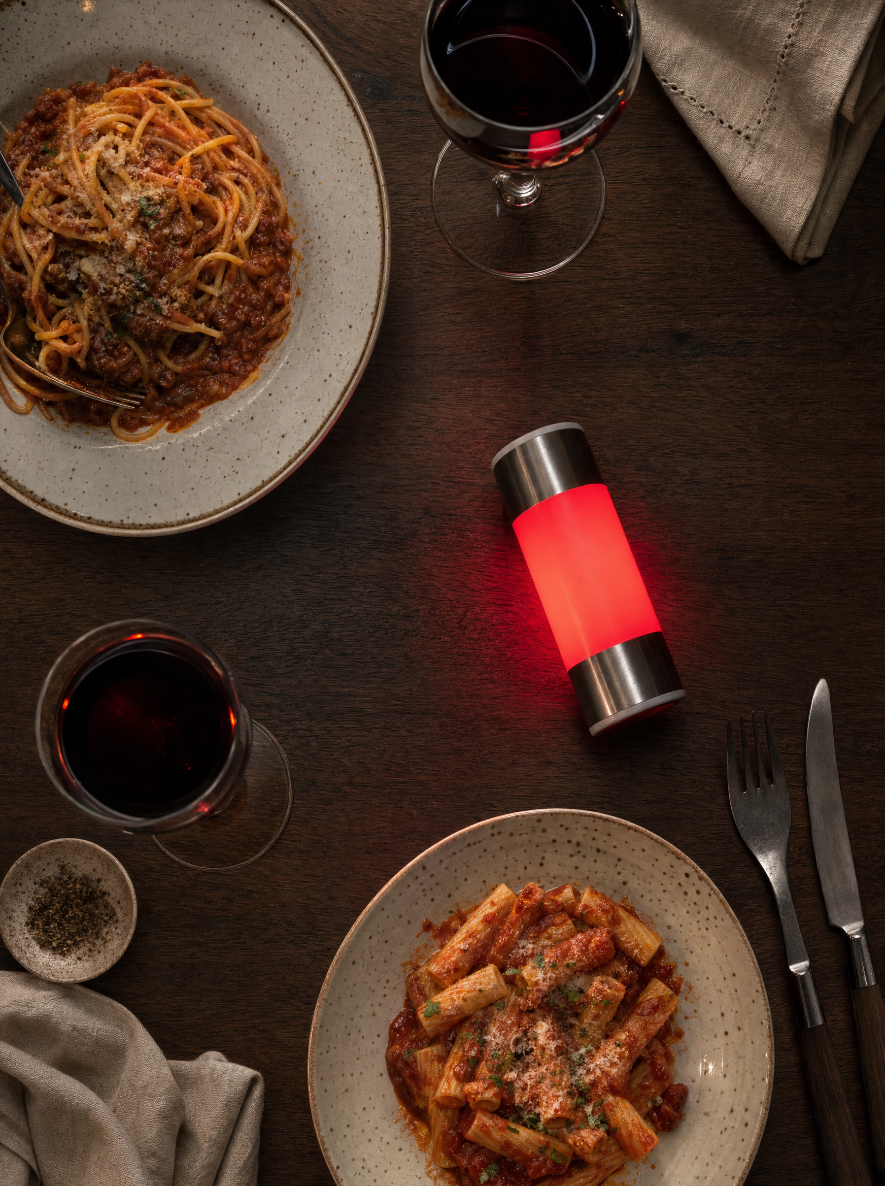 A table set for two with a FlipLight glowing red